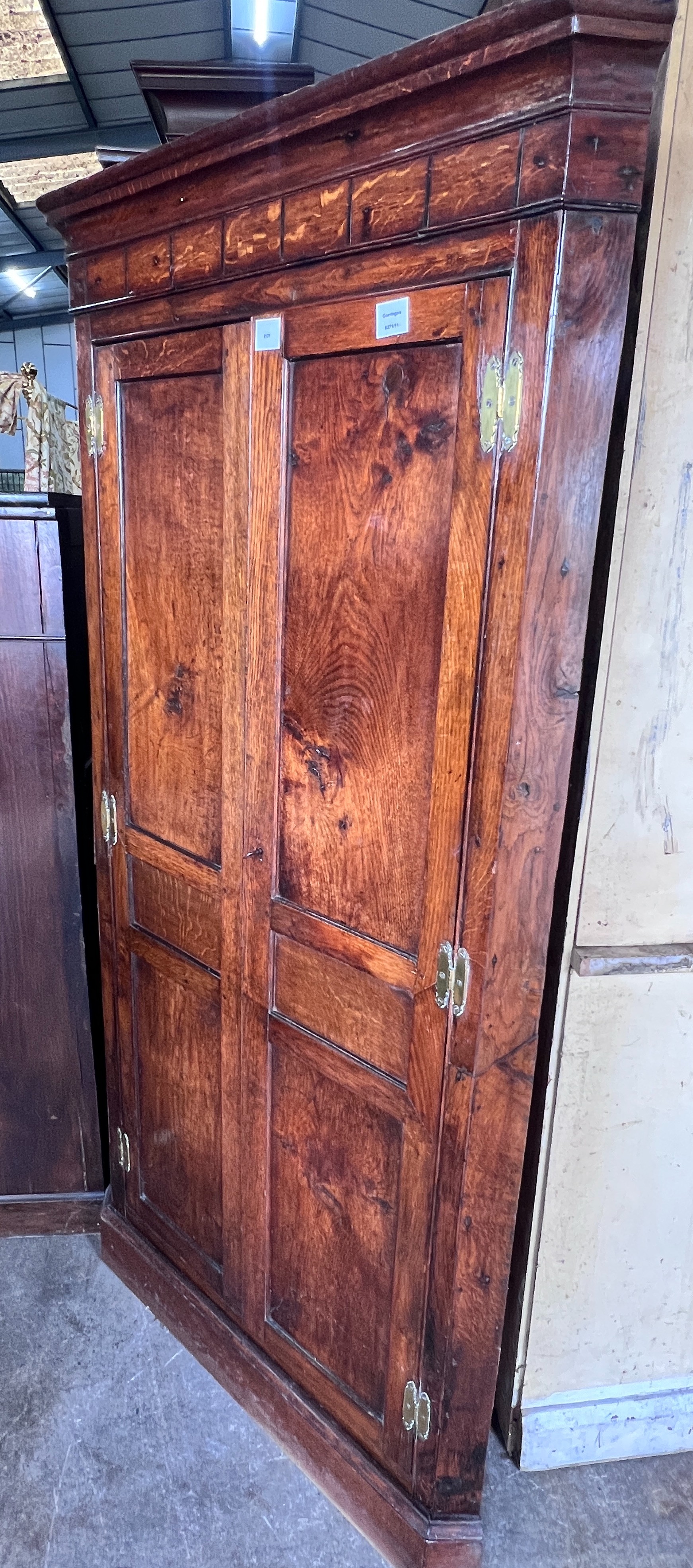 A George III provincial oak standing corner cabinet, width 94cm, depth 50cm, height 185cm